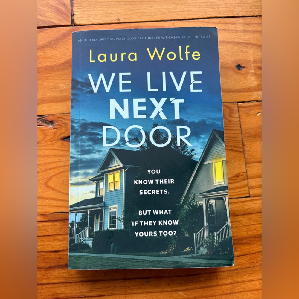 Suspense/thrill/mystery Book***WE LIVE NEXT DOOR by Laura Wolfe